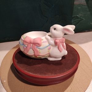 Vintage ceramic egg cup holder features a cute Easter bunny rabbit decorated egg